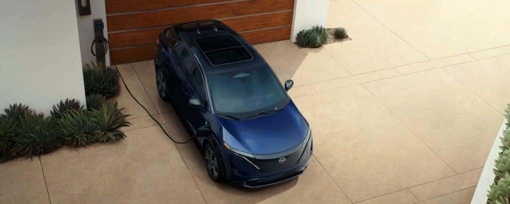 a 2025 Nissan Ariya parked in a driveway