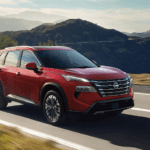 Red 2026.5 Nissan Rogue cruising