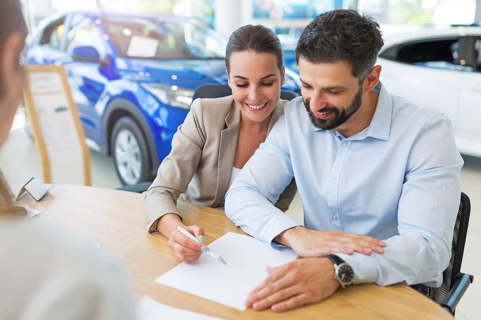 Couple financing a new BMW at BMW dealership in Albany, GA.