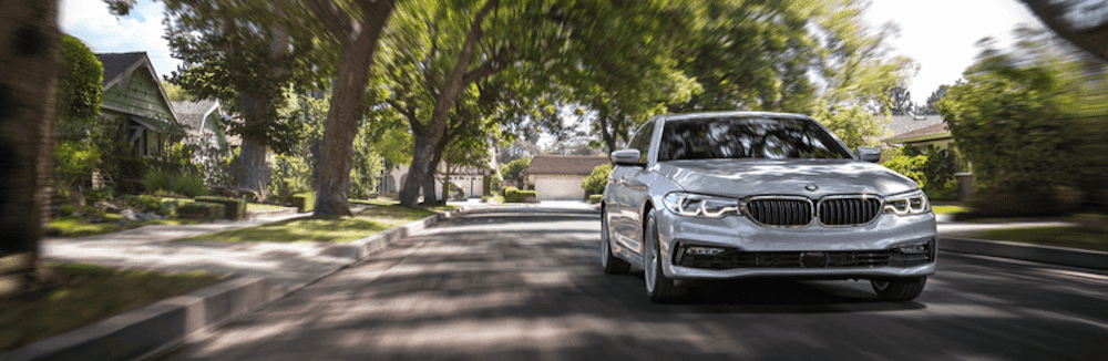 2022 BMW 5 Series driving towards camera