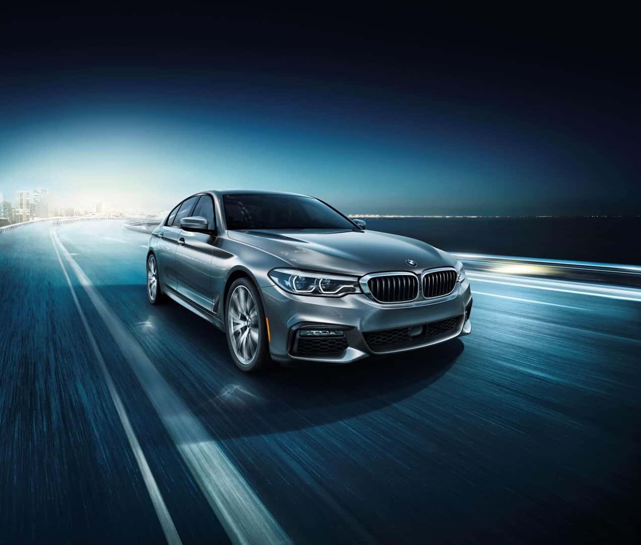 BMW 5 Series in Gray on Road