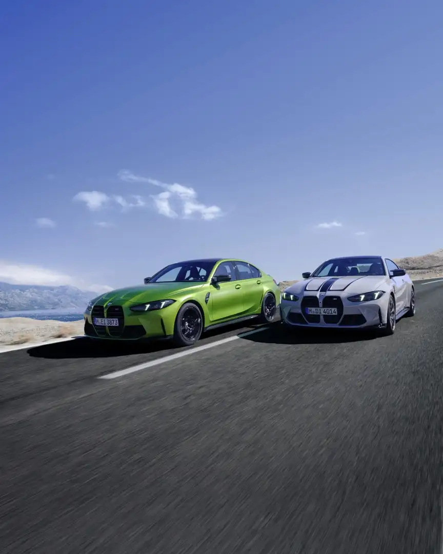 BMW M3 Competition and M4 Competition on a coastal road