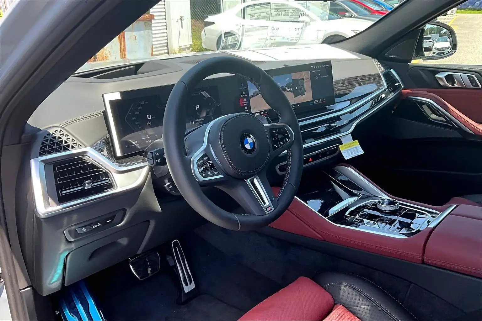 2027 BMW X6 M60i — M wheel and red brake caliper