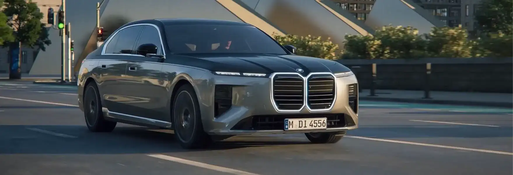2027 BMW 7 Series driving on an open road, demonstrating its driving dynamics