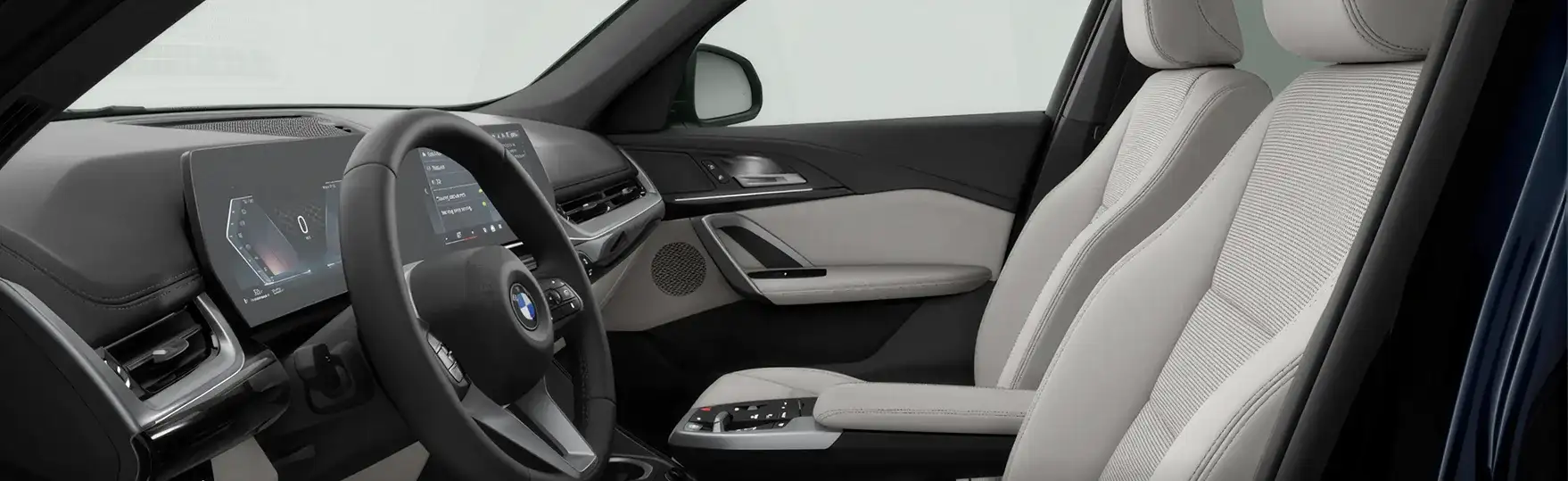 Interior of the 2027 BMW X1 showing the front cabin, dashboard and BMW Curved Display