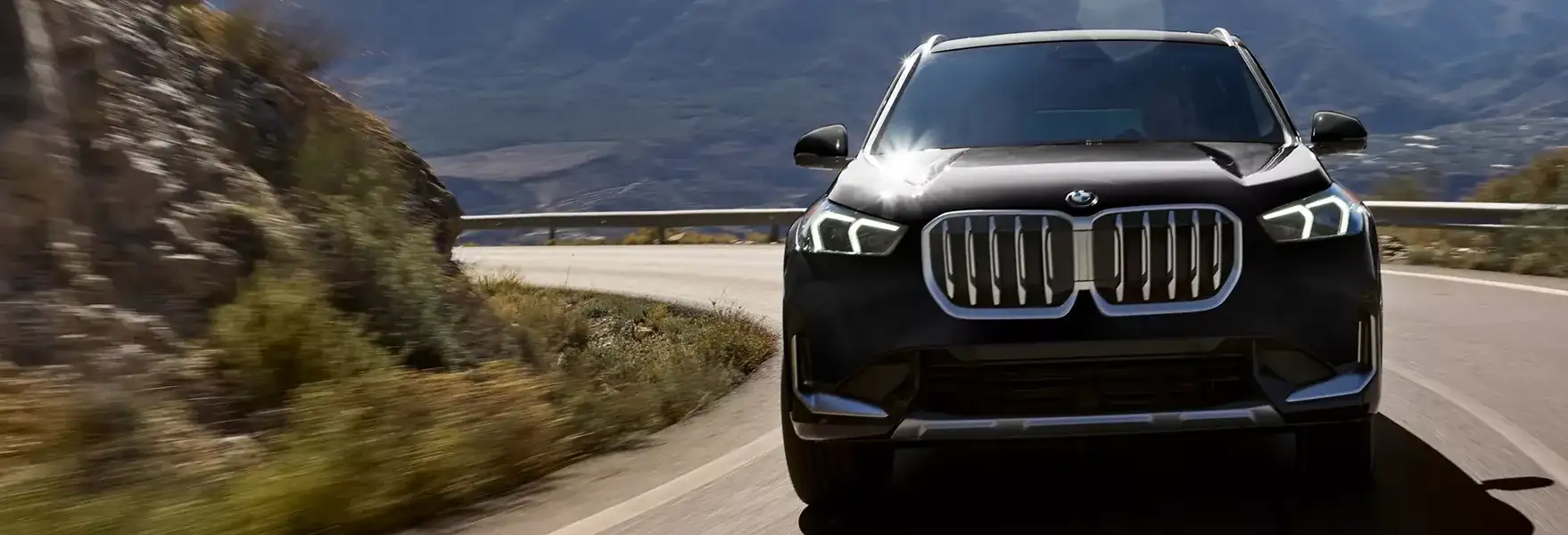 2027 BMW X1 parked on a gravel trail at dusk, ready for everyday adventures