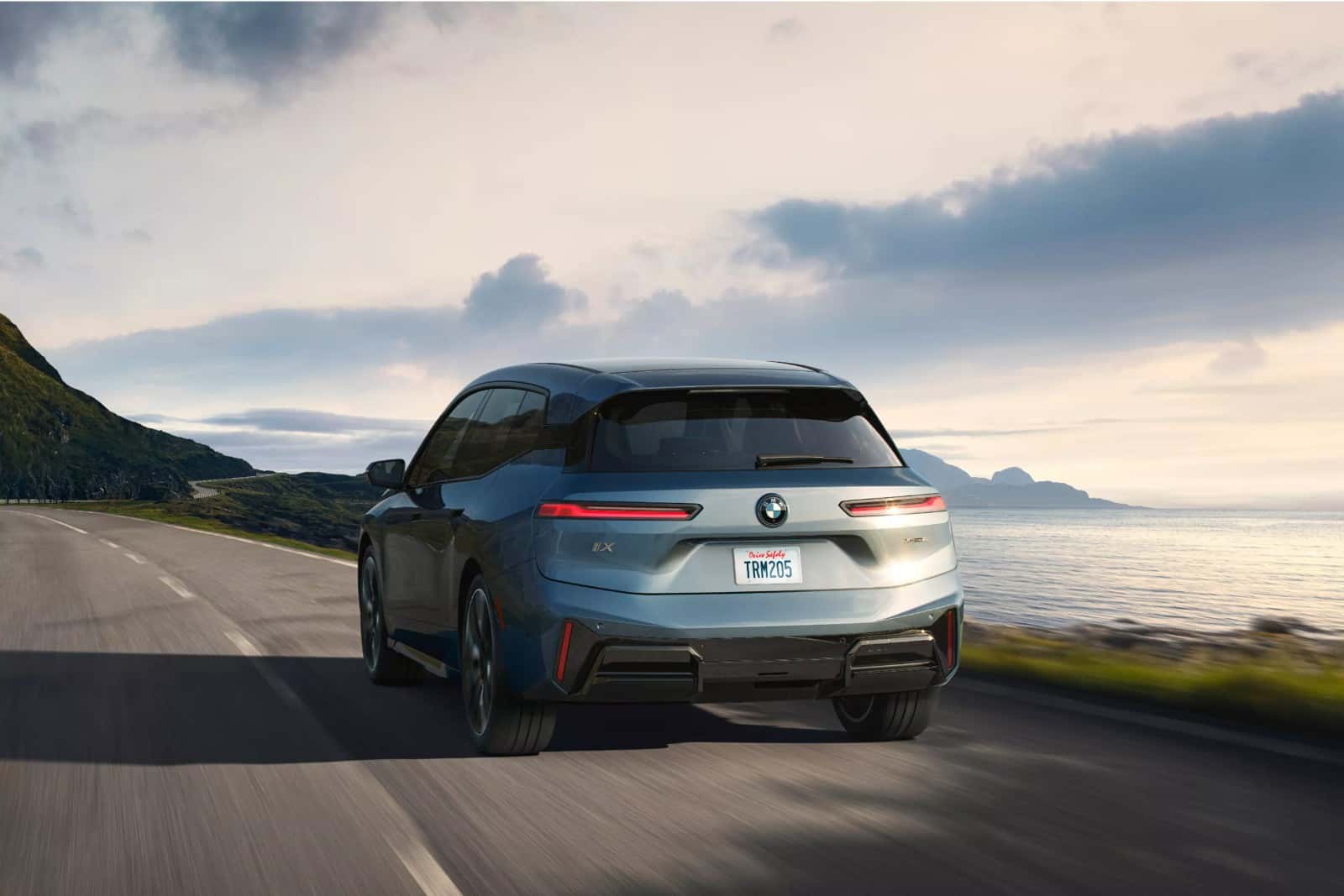 BMW 5 Series sedan on the open road, available to test drive at BMW of Fort Walton Beach