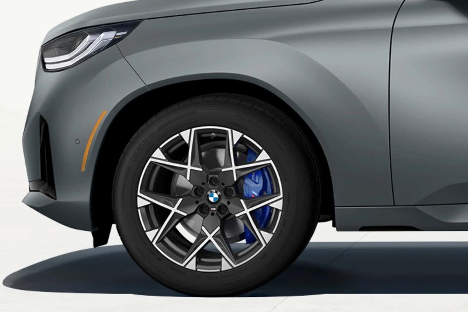 BMW M light-alloy wheel with blue M brake caliper, serviced at BMW of Fort Walton Beach, FL