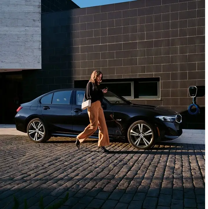 BMW 3 Series sedan parked outside a modern home, the kind of specific trim we stage for a booked test drive at BMW of Fort Walton Beach
