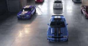 Multiple 2023 Dodge Challenger models lined up in a garage