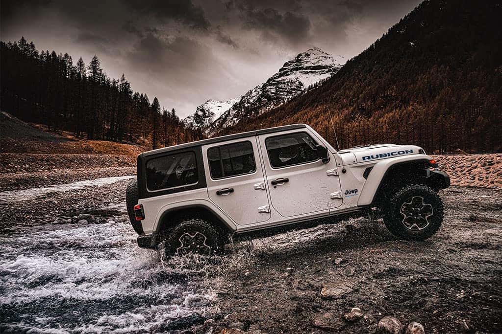 2023 Jeep Wrangler 4xe Rubicon off-roading in a river