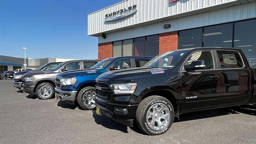 RAM work trucks a in parking lot at Bud Clary Chrysler Dodge Jeep RAM