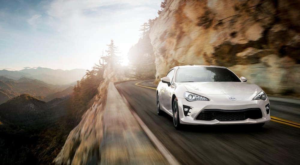 A white 2020 Toyota Corolla 86 is driving in the mountains after leaving an Indiana, PA car dealer.