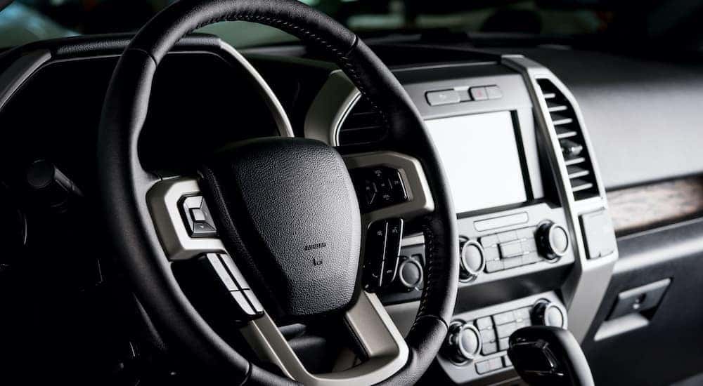 THe steering wheel of a truck at a used truck dealership in PA is shown.