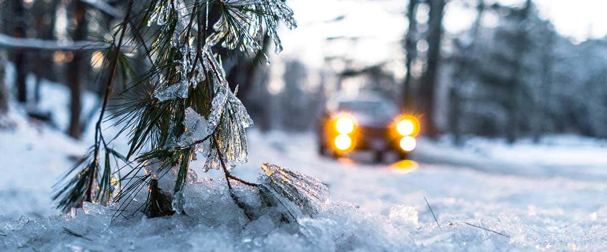 Car in background snowy road