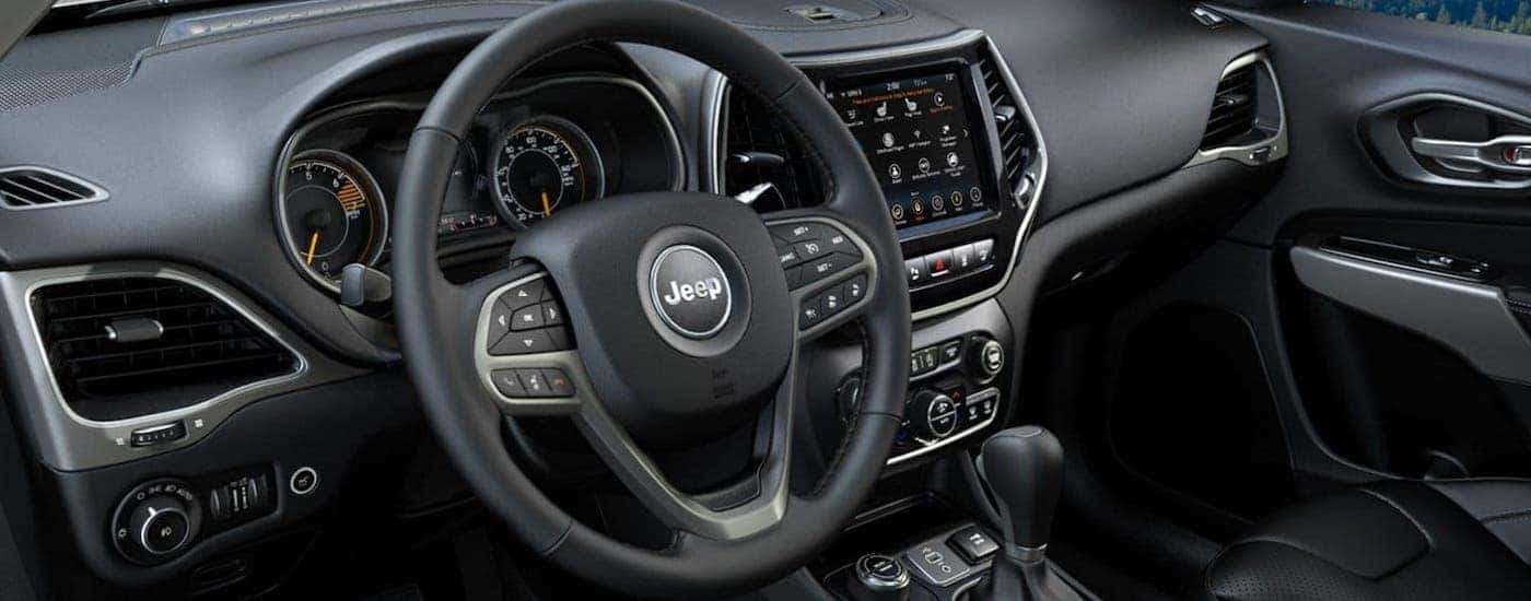 The black interior of a 2020 Jeep Cherokee is shown.