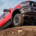A red 2020 Ram 2500 Power Wagon is shown from a low angle while parked on a dirt mound.