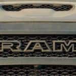 A closeup shows a dirty grille on a 2021 Ram 1500 TRX, coming soon to a Ram dealership near you.