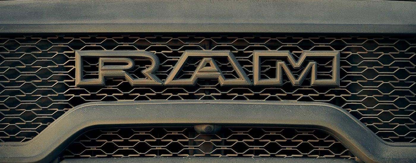 A closeup shows the grille of a 2021 Ram 1500 TRX from the front.