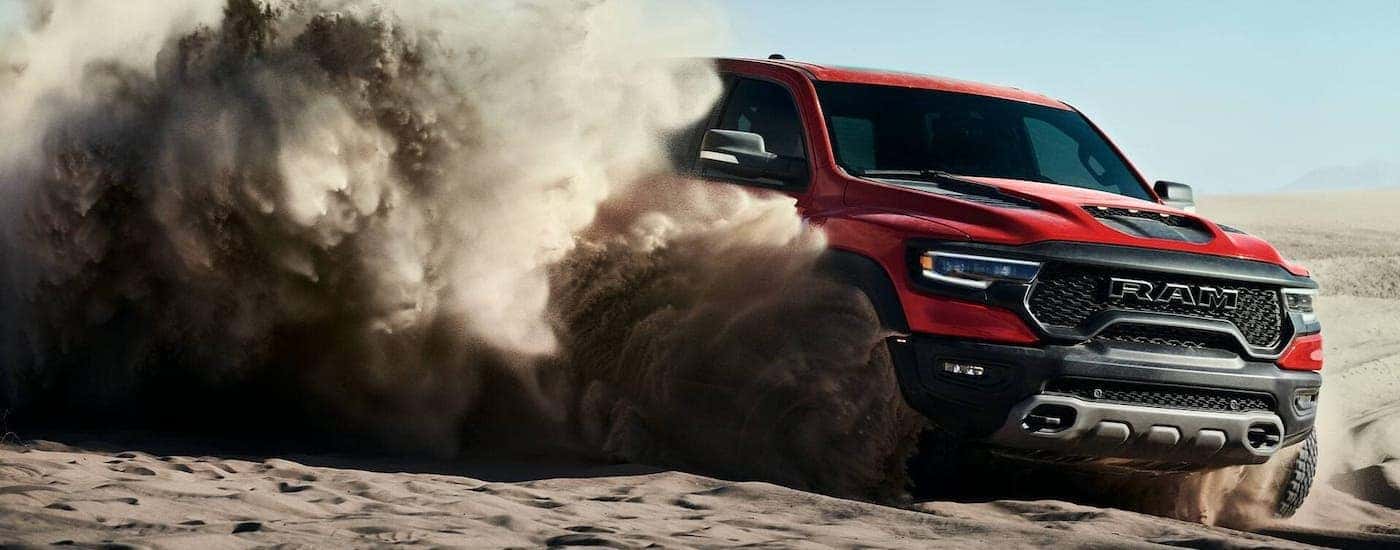 A red 2021 Ram 1500 TRX is kicking up sand in a pit near Findlay, OH.