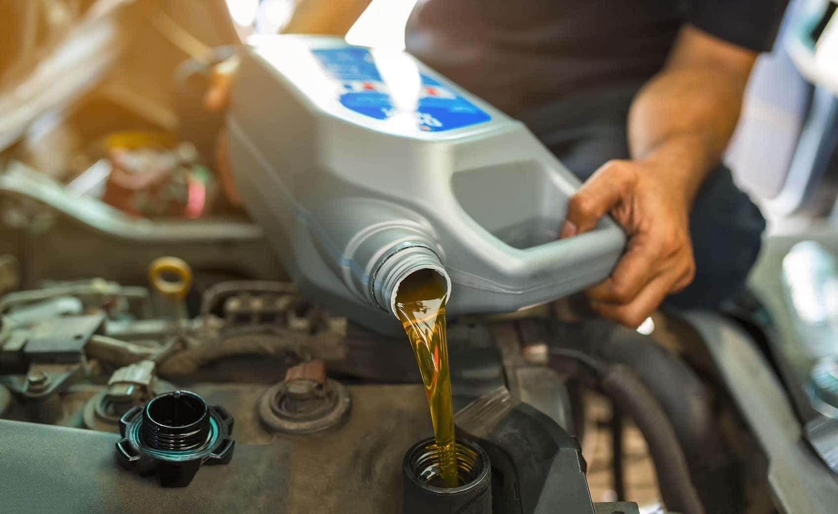 Mechanic changing the oil