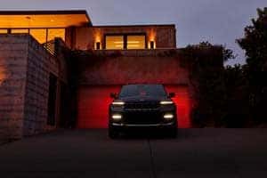 Jeep Grand Cherokee L in the driveway.