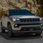 Jeep Compass driving on winding mountain road
