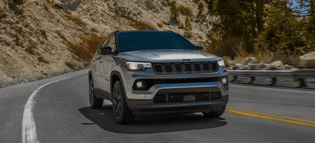 Jeep Compass driving on winding mountain road