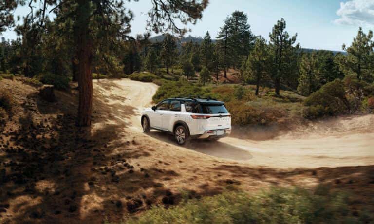 2022 Nissan Pathfinder exterior driving on drit trail