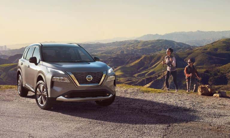 2022 Nissan Rogue exterior in front of hills with hikers