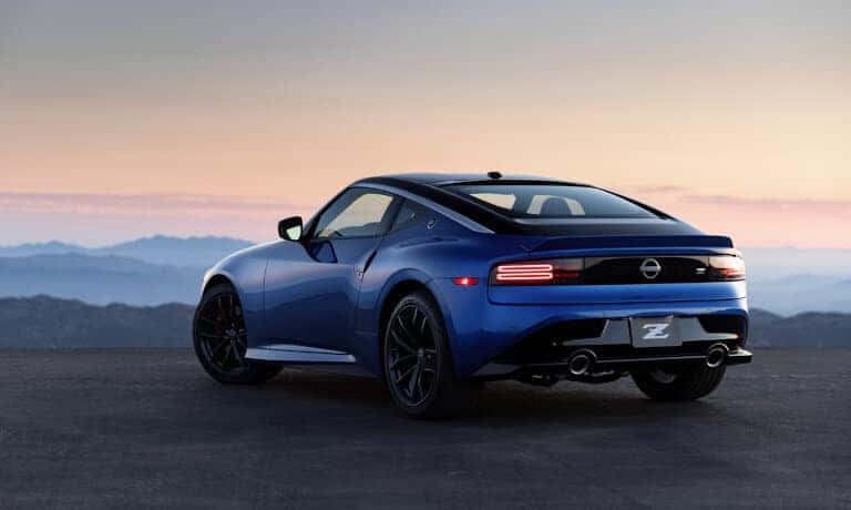 2023 Nissan Z parked in front of misty mountains
