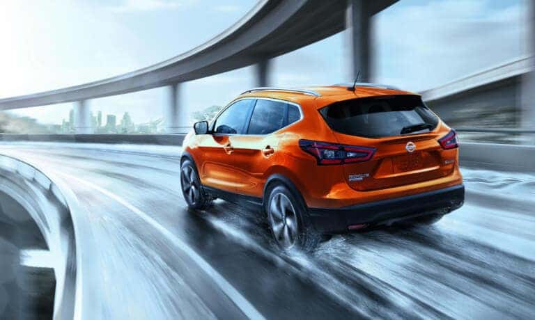 2022 Nissan Rogue Sport driving fast on a snowy road