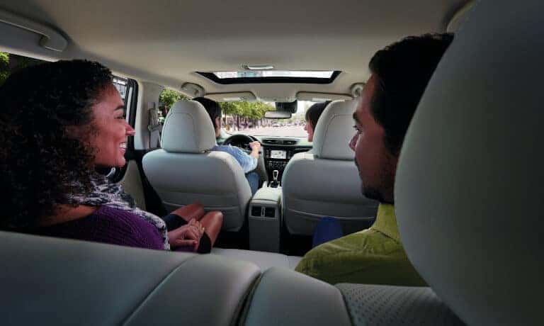 2022 Nissan Rogue Sport interior with passengers