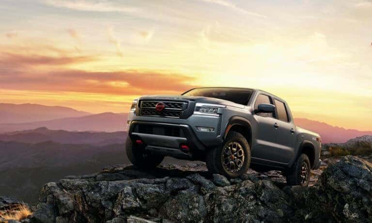 2023 Nissan Frontier on a cliff at sunset