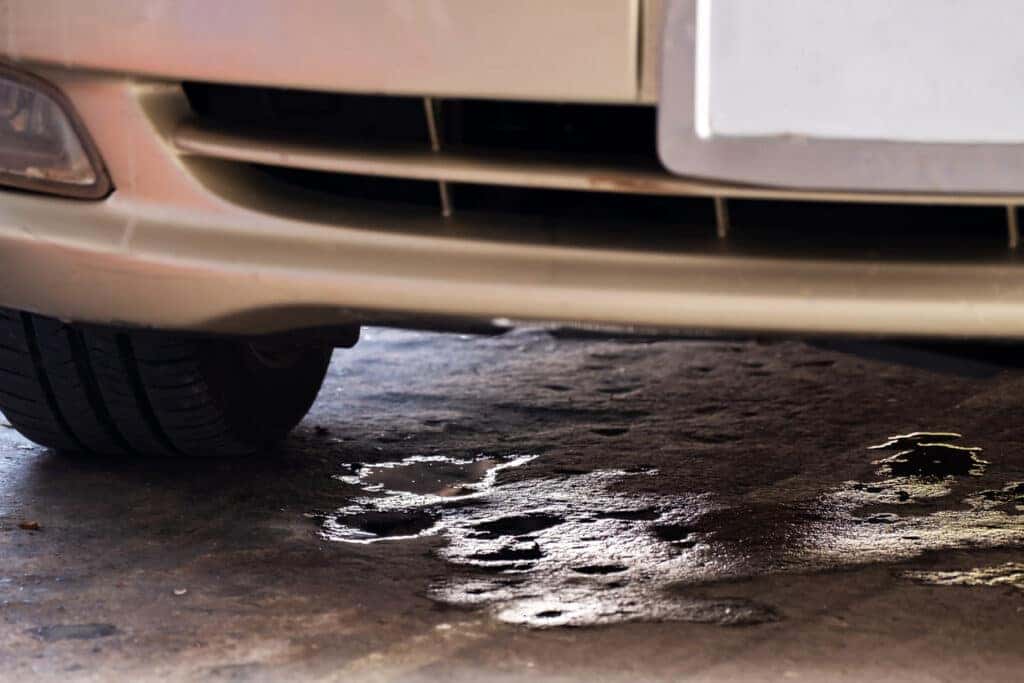 Engine fluid leaking from a parked car.