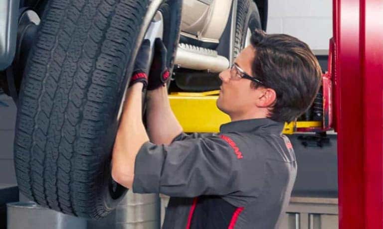 Service Technician Replacing Tire
