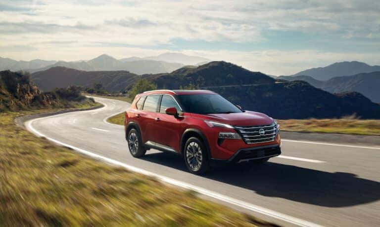 2025 Nissan Rogue Exterior Driving In Hills