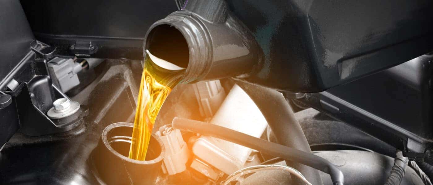 Nissan Service Oil Change Pouring Oil