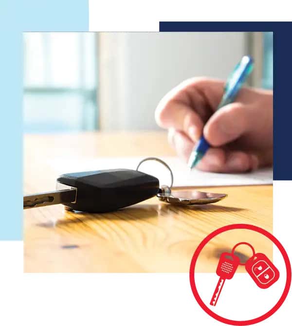 Reduce your monthly payments by trading in your current vehicle. Image of hand signing document on w…
