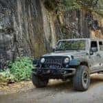 2022 jeep gladiator parked on gravel path next to sheer rock wall