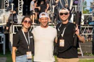 Jeff Belzer and two people taking photo after being on stage at Lakefront Music Fest