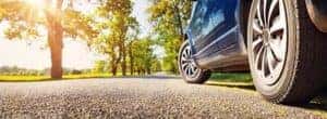 view of tires on pavement on sunny day