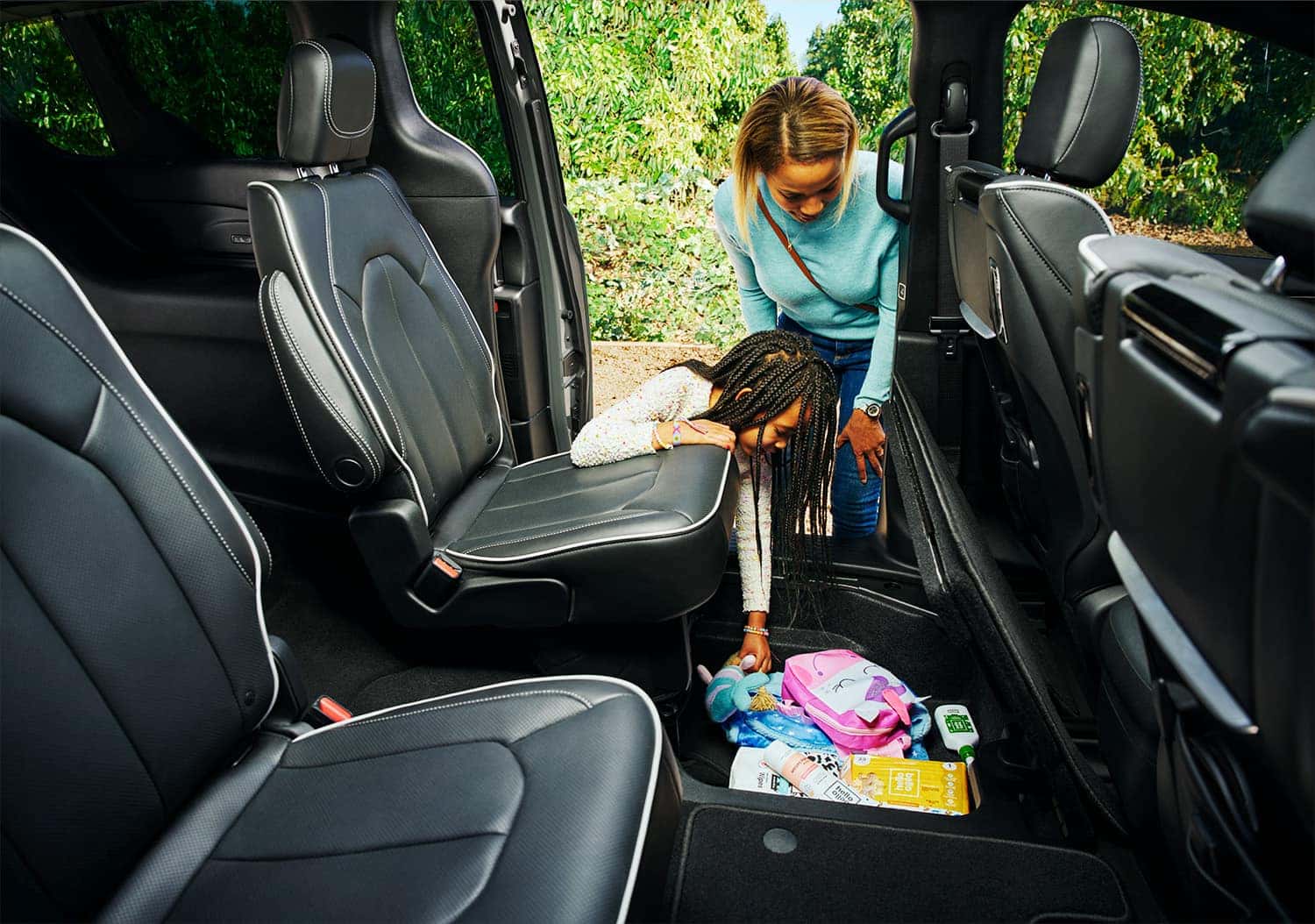 Chrysler Pacifica Stow 'n Go feature with extra storage in compartment in floorboard