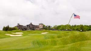 Golf field with a clubhouse and an american flag