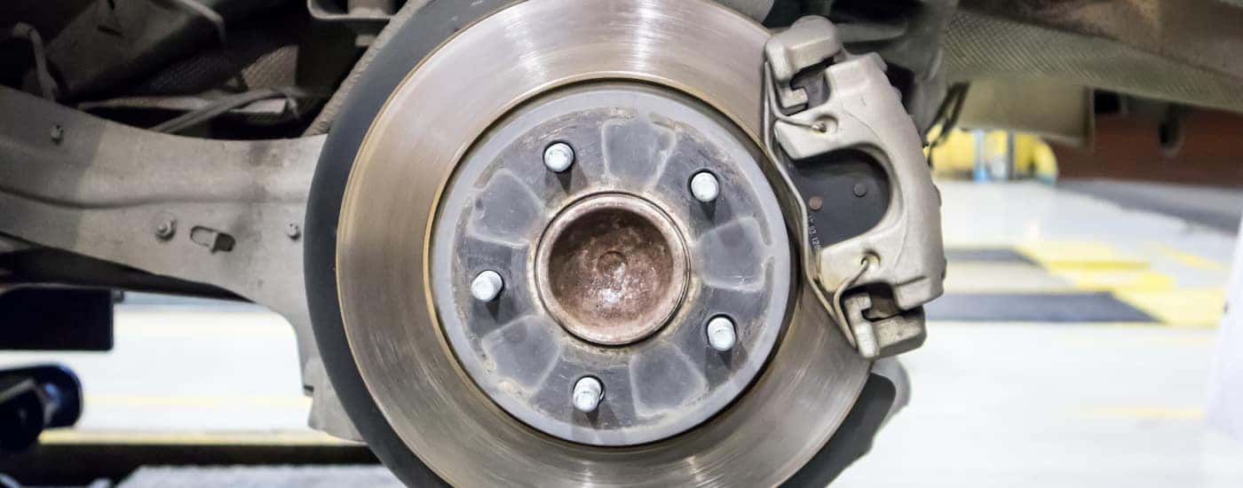 Close up of brake pads being serviced.