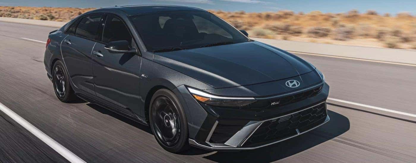 A gray 2026 Hyundai Elantra N Line driving a paved road.