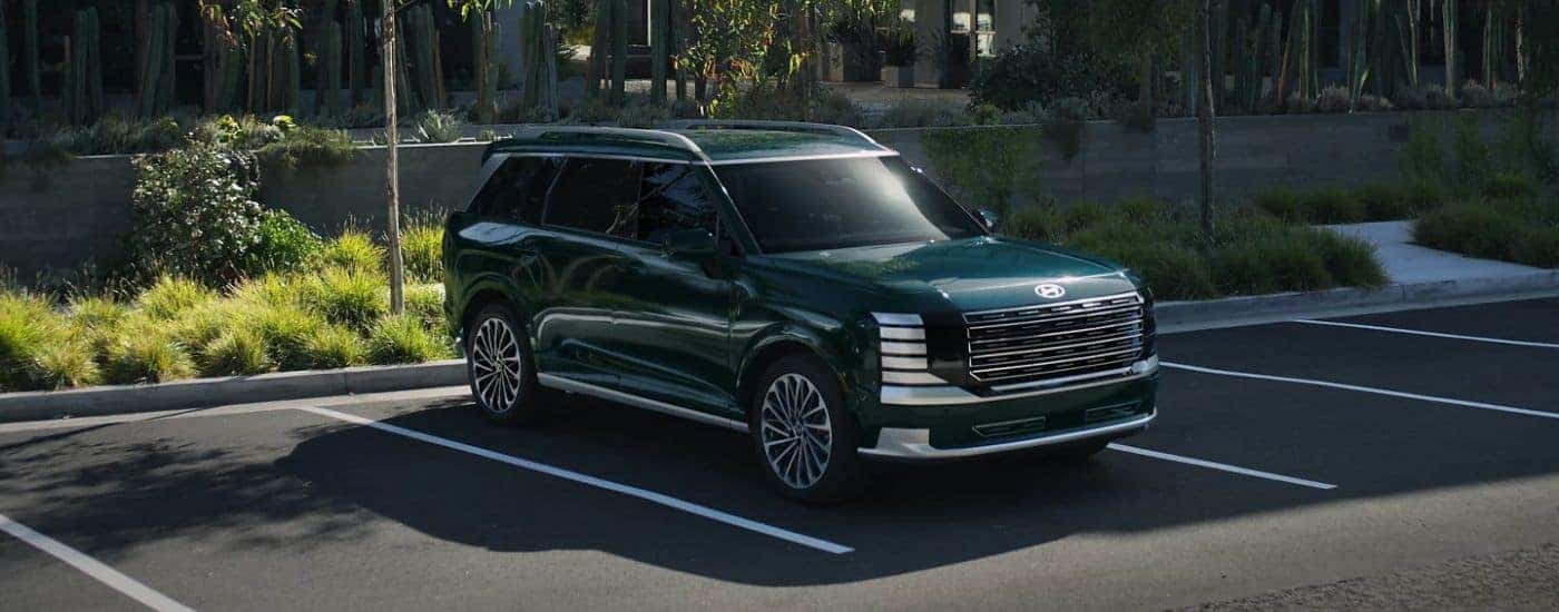 A green 2026 Hyundai Palisade Calligraphy parked.