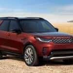 A 2026 Land Rover Discovery parked near a ricefield