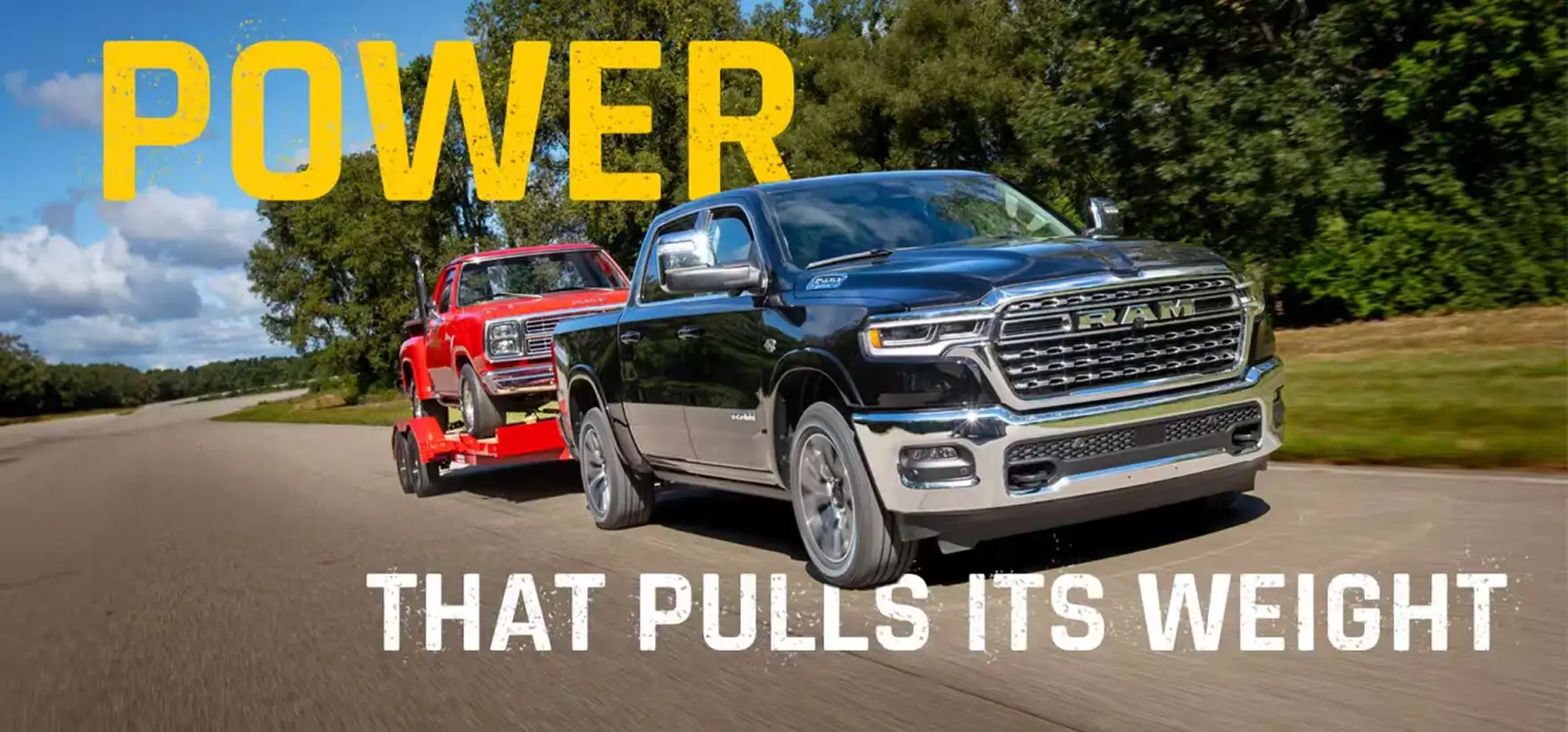 Black RAM 1500 towing a red vintage pickup on a trailer down a country road beneath the headline Power That Pulls Its Weight