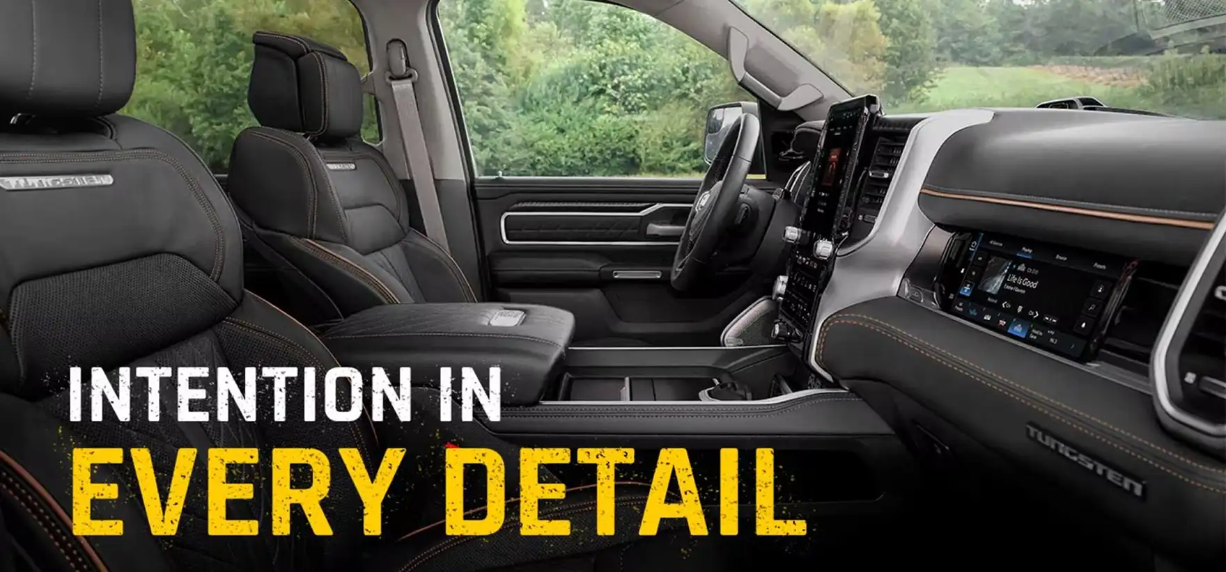 Black leather RAM 1500 Tungsten cabin with copper stitching beneath the headline Intention in Every Detail